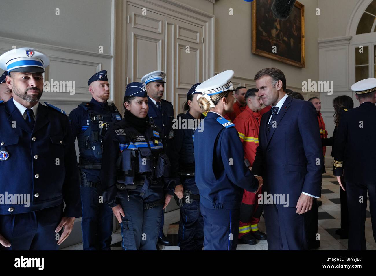 French President Emmanuel Macron meets with firefighters and police ...