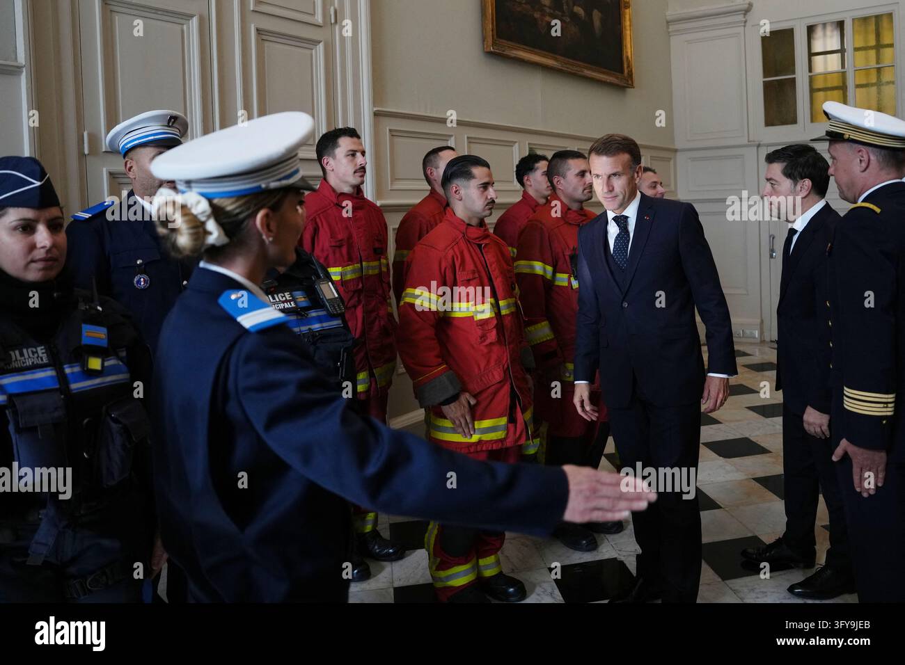 French President Emmanuel Macron meets with firefighters and police ...