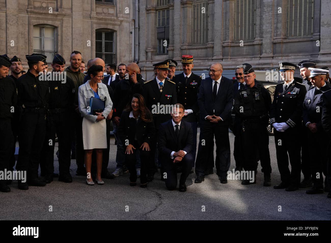 French President Emmanuel Macron poses with the police force at the ...