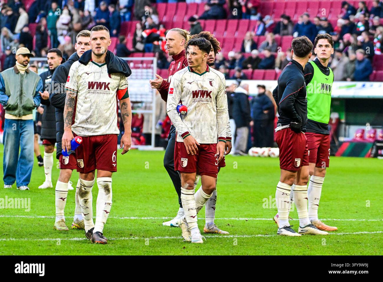 Wolves Player Images Augsburg players after the game, Marius Wolf (FC Augsburg, #27), Fabian ...