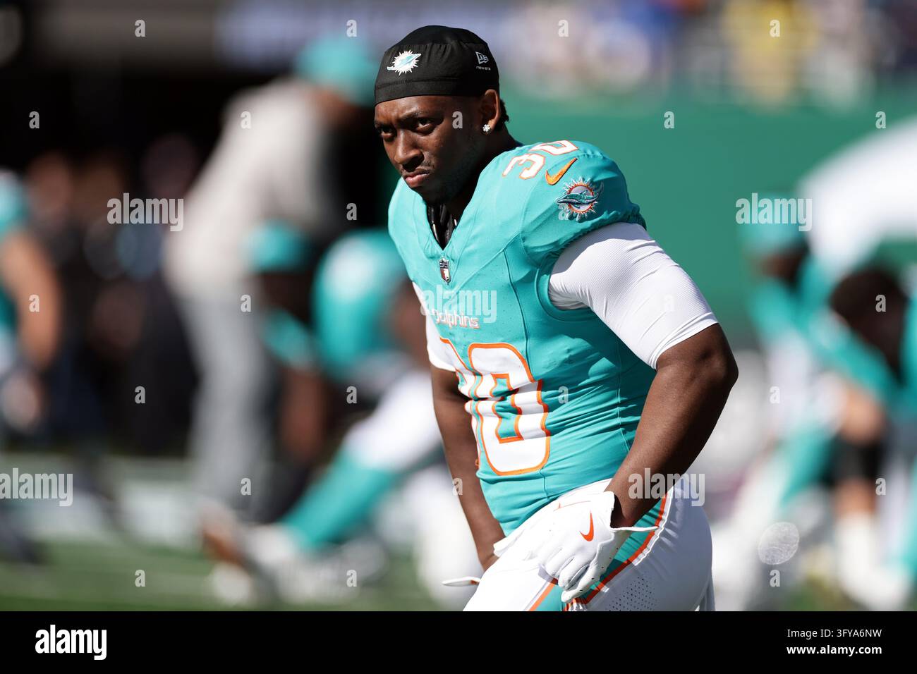 Miami Dolphins running back Kaytron Allen (30) warms up before an NFL ...