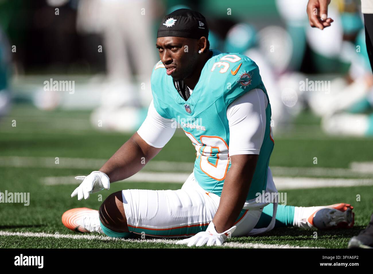 Miami Dolphins running back Kaytron Allen (30) warms up before an NFL ...