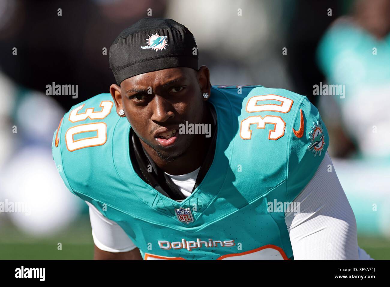 Miami Dolphins running back Kaytron Allen (30) warms up before an NFL ...