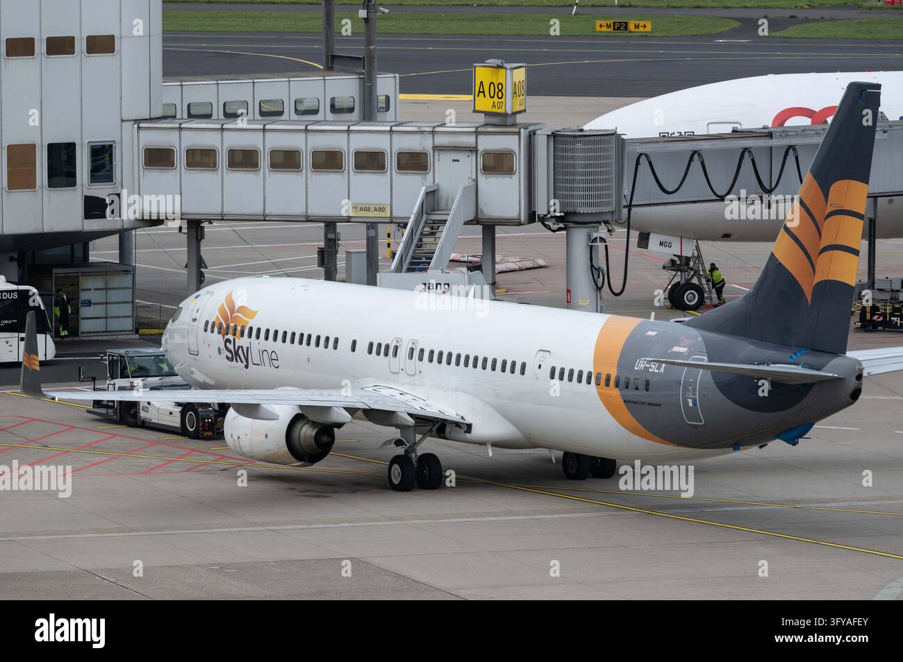 A Boeing 737 of Skyline Express, call sign UR-SLX, is parked at the ...