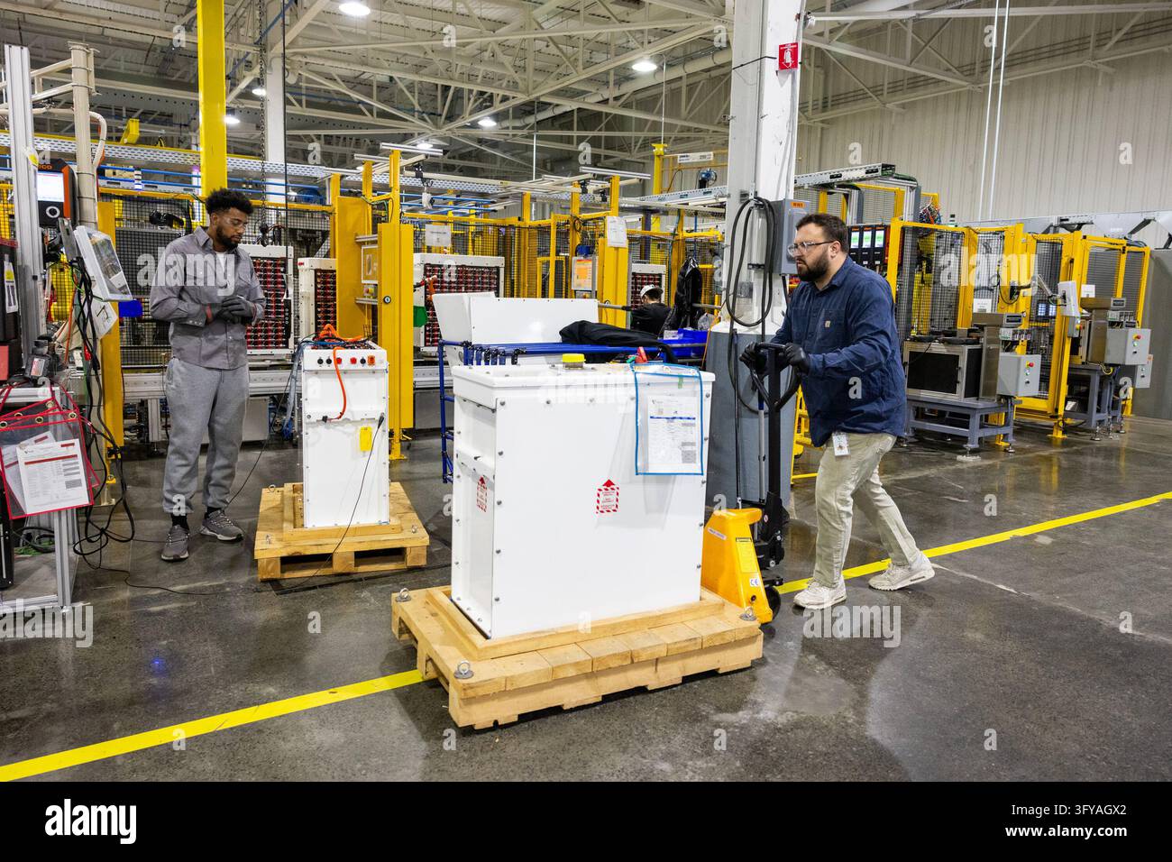 Storage System Image Alex Jensen moves a lithium-ion battery energy storage system inside ...