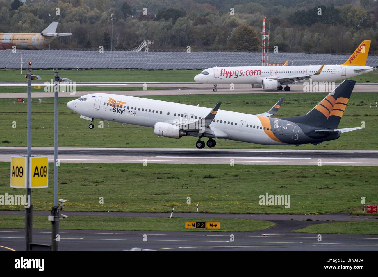 File Processing Background A Boeing 737 of Skyline Express, call sign UR-SLX, takes off from ...