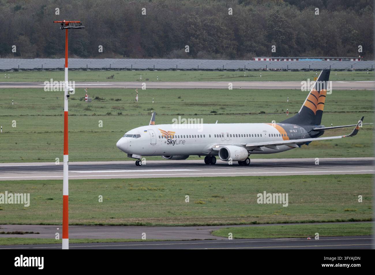 A Boeing 737 of Skyline Express, call sign UR-SLX, takes off from ...