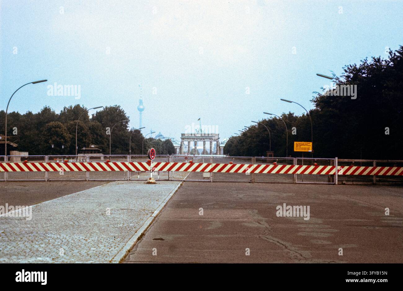 Berlin, Germany, 1980. The Brandenburg Gate seen across the restricted ...