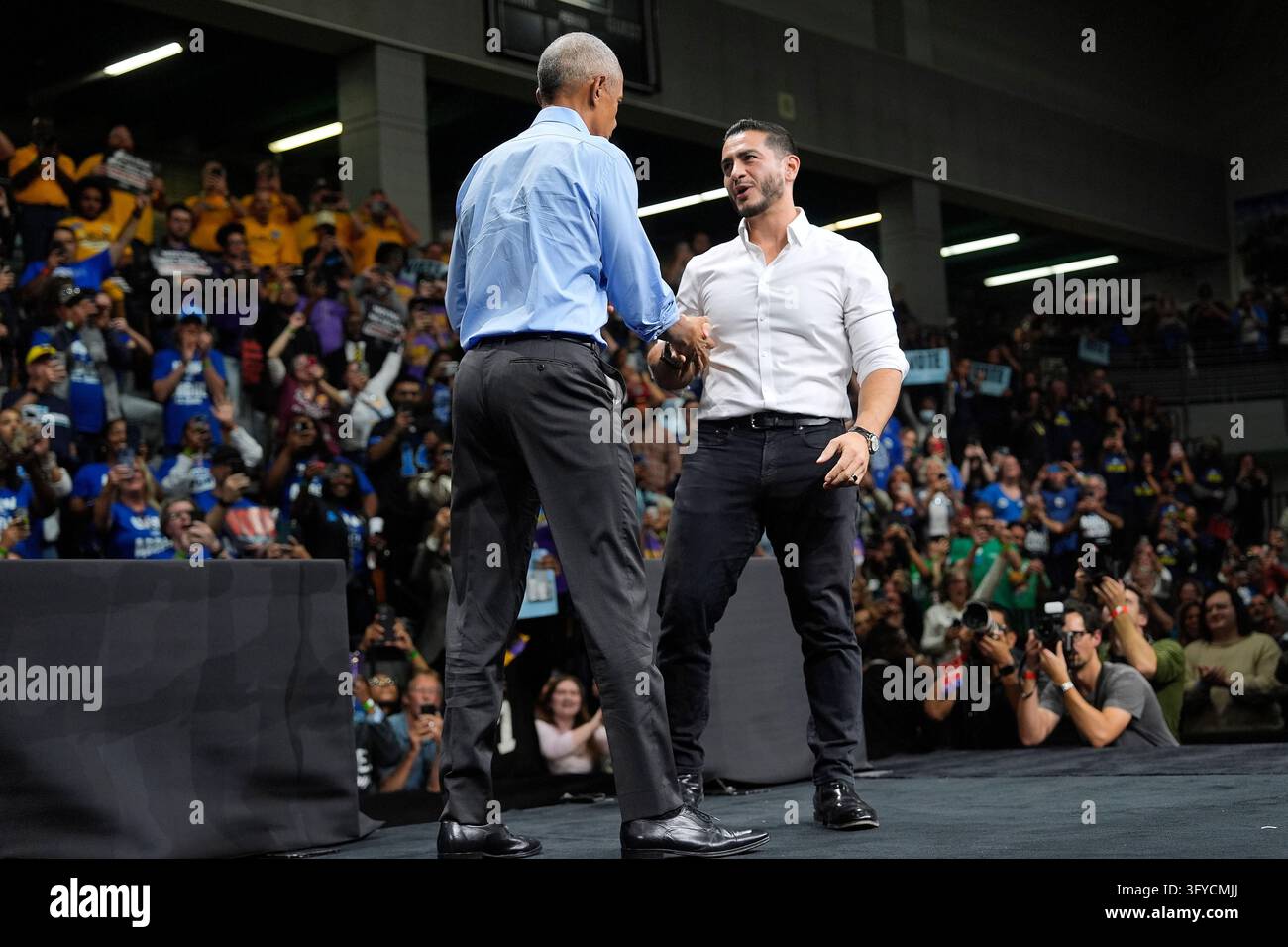 For President Vector Democratic nominee for U.S. Senate Abdul El-Sayed, right, shakes hands ...