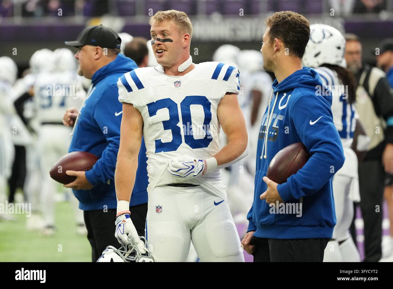 Indianapolis Colts safety Hunter Wohler (30) talks with staff before an ...