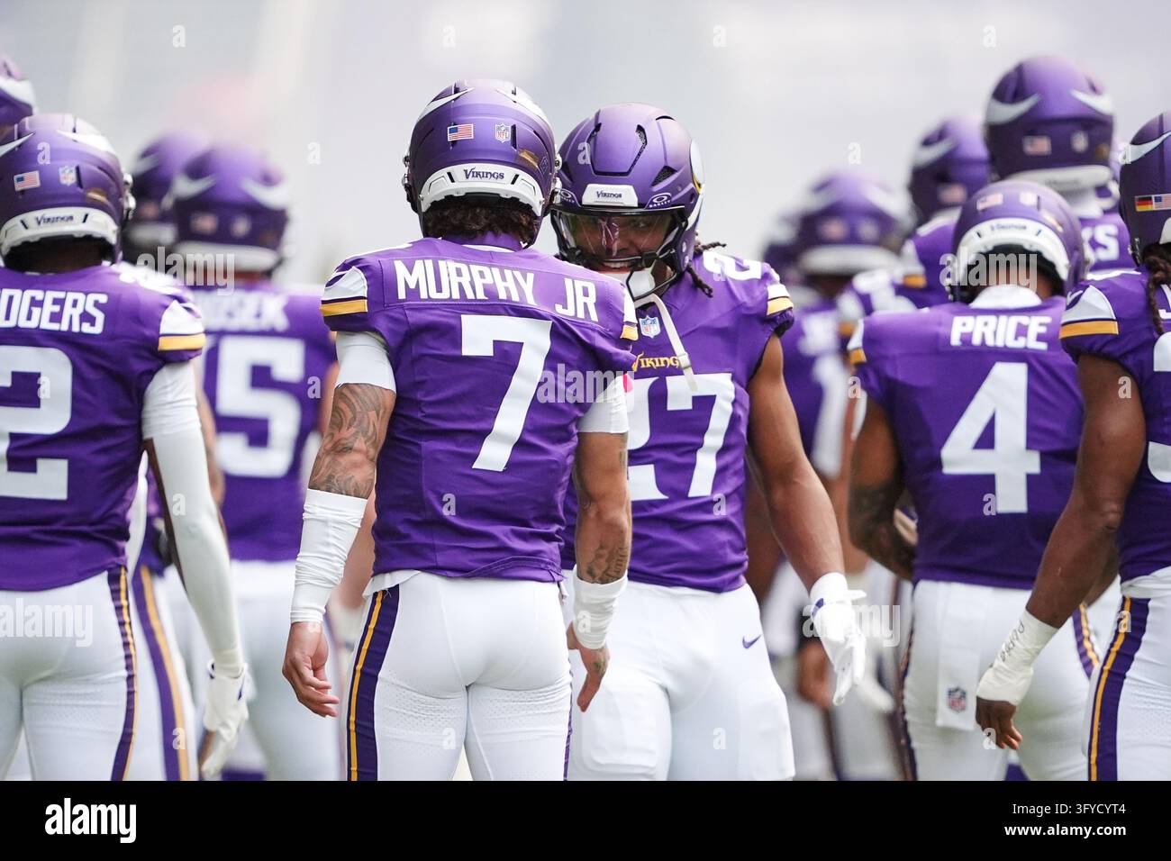 Minnesota Vikings running back Jordan Mason (27) greets cornerback ...