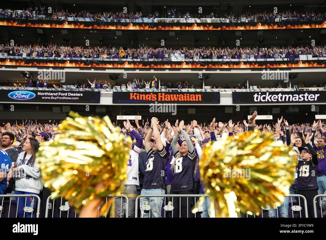 Minnesota Vikings fans cheer for their team before an NFL football game ...
