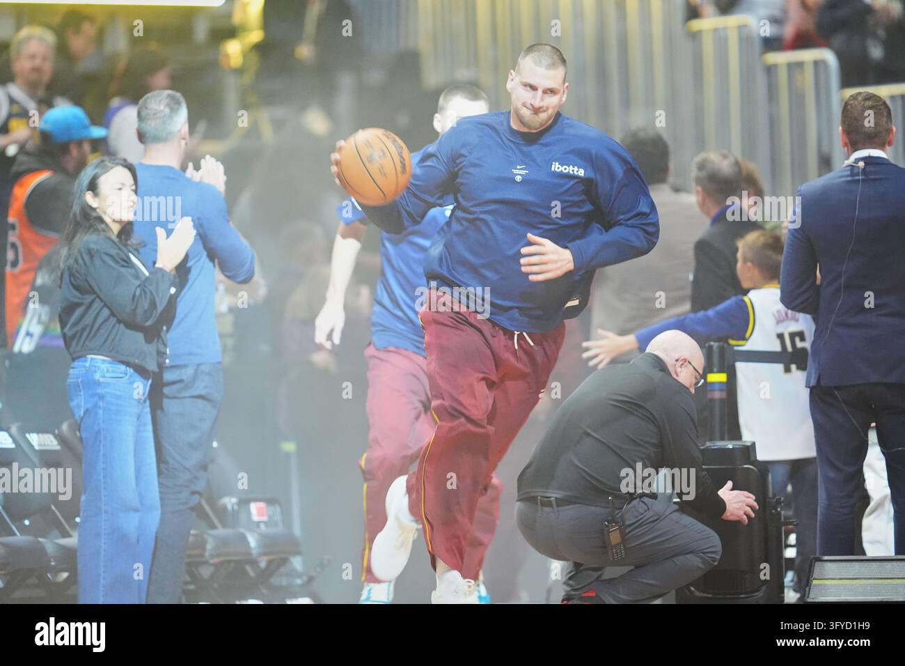 Denver Nuggets center Nikola Jokić (15) takes the court in the first ...