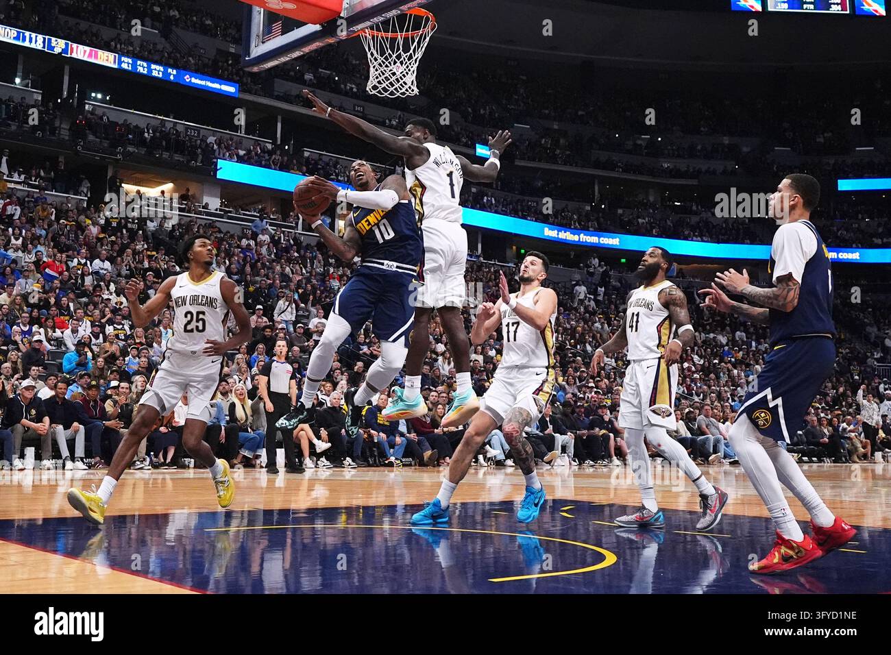 Denver Nuggets guard DeMar DeRozan (10) drives to the rim as, from left ...