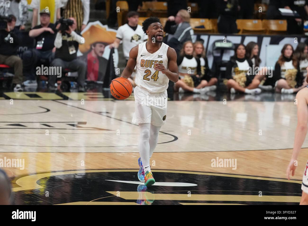 Moving In Game FILE - Colorado guard Barrington Hargress moves the ball down the court ...