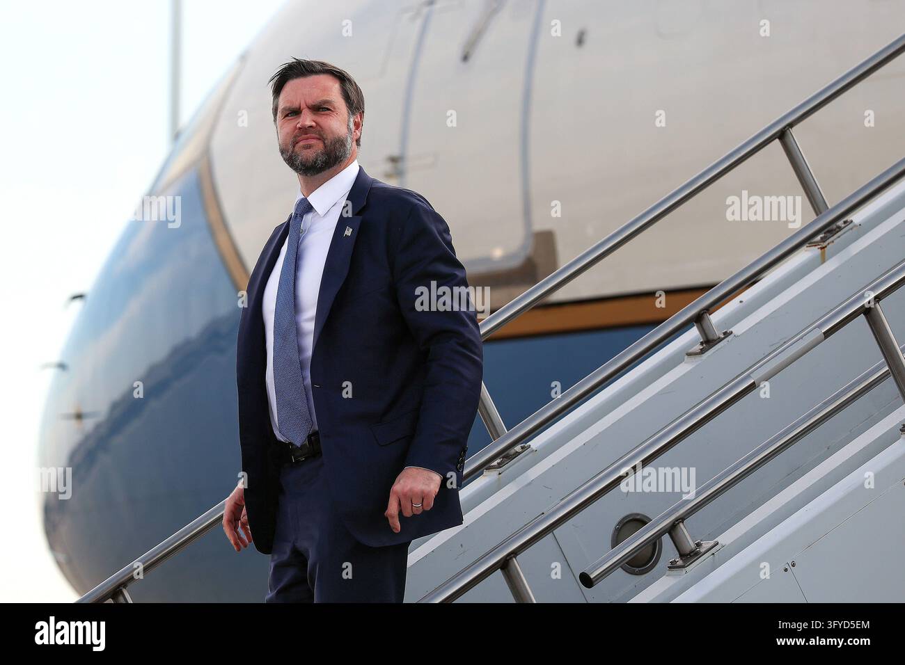 Vice President JD Vance steps off Air Force Two as he arrives at Topeka ...