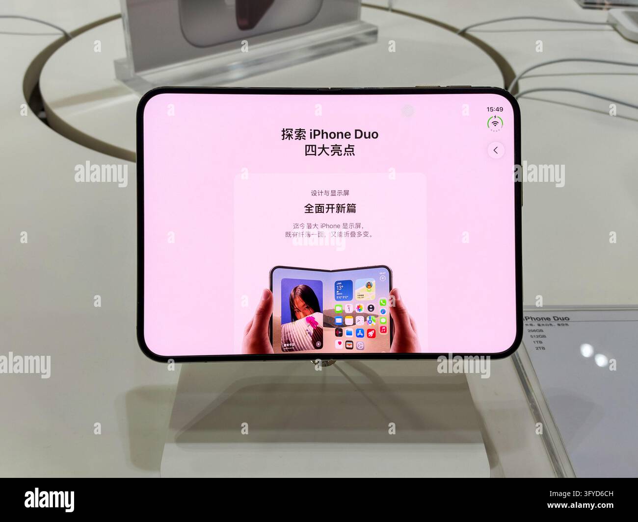 YANGZHOU, CHINA - OCTOBER 26, 2026 - A citizen experiences Apple's ...