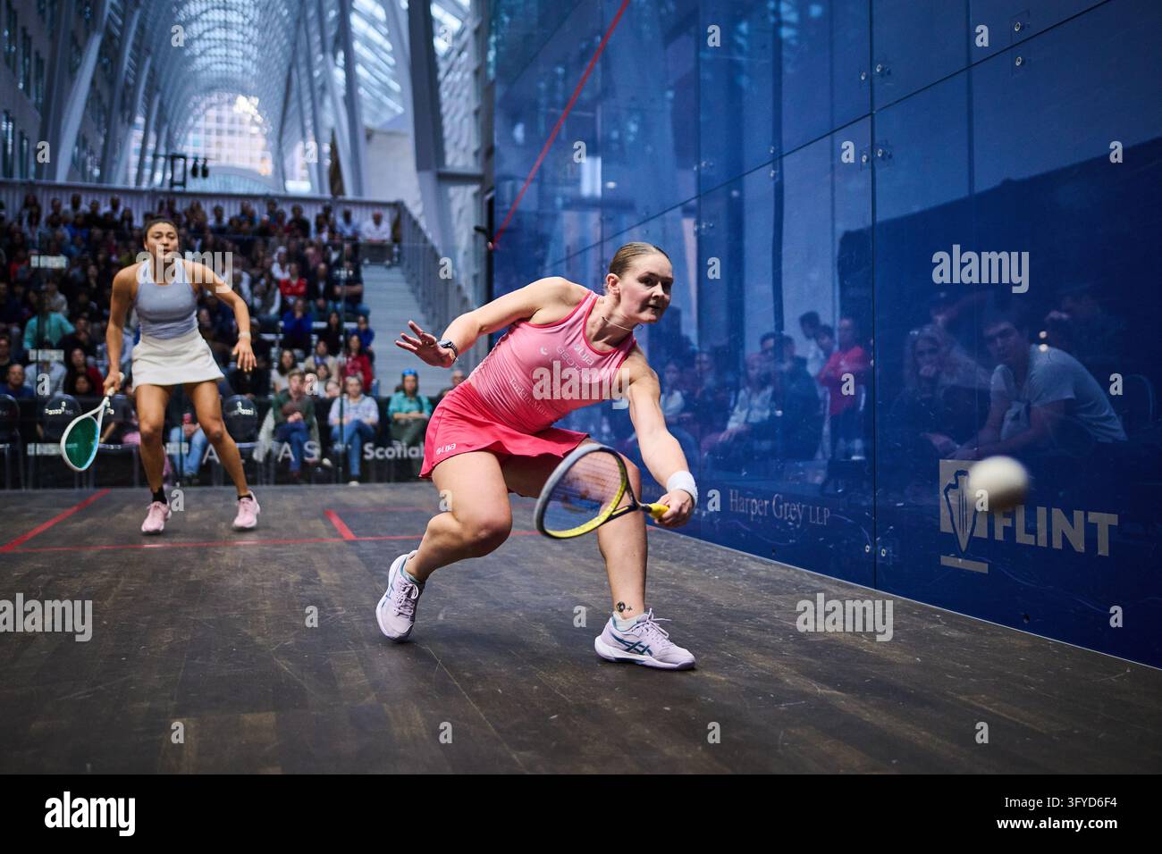 Hollie Naughton, right, plays a shot against Nicole Bunyan as the two ...