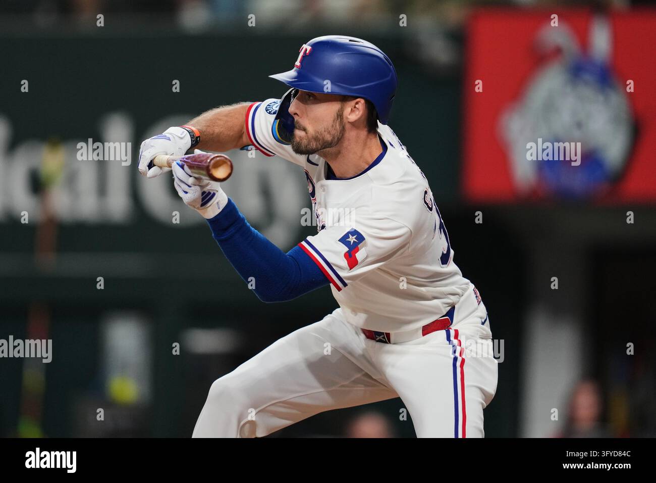 Texac Rangers Texas Rangers' Evan Carter prepares to bunt during a baseball game ...