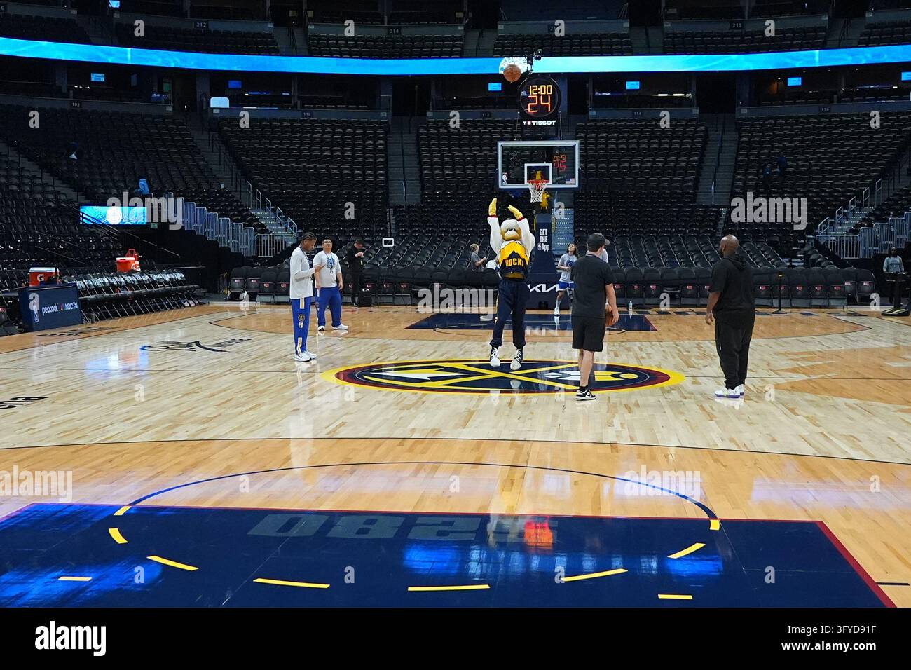 Denver Nuggets mascot Rocky the mountain lion, center, practices his ...
