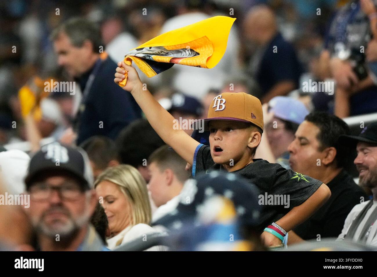 A fan cheers during the first inning of Game 3 of baseball's World ...