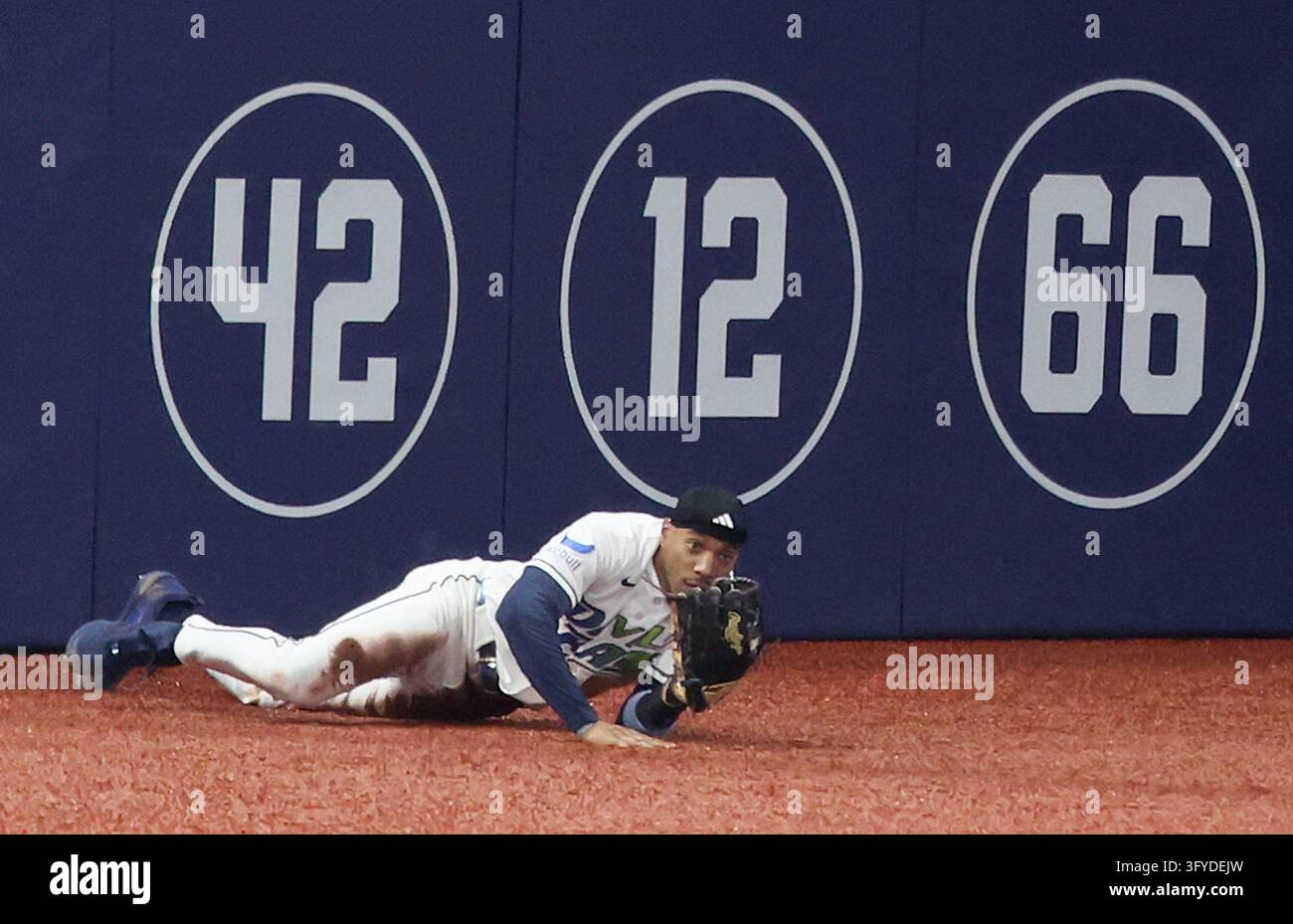Tampa Bay Rays left fielder Chandler Simpson (14) gets to his feet ...