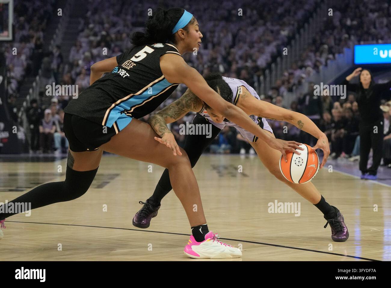 Atlanta Dream forward Angel Reese (5) reaches for the ball next to ...