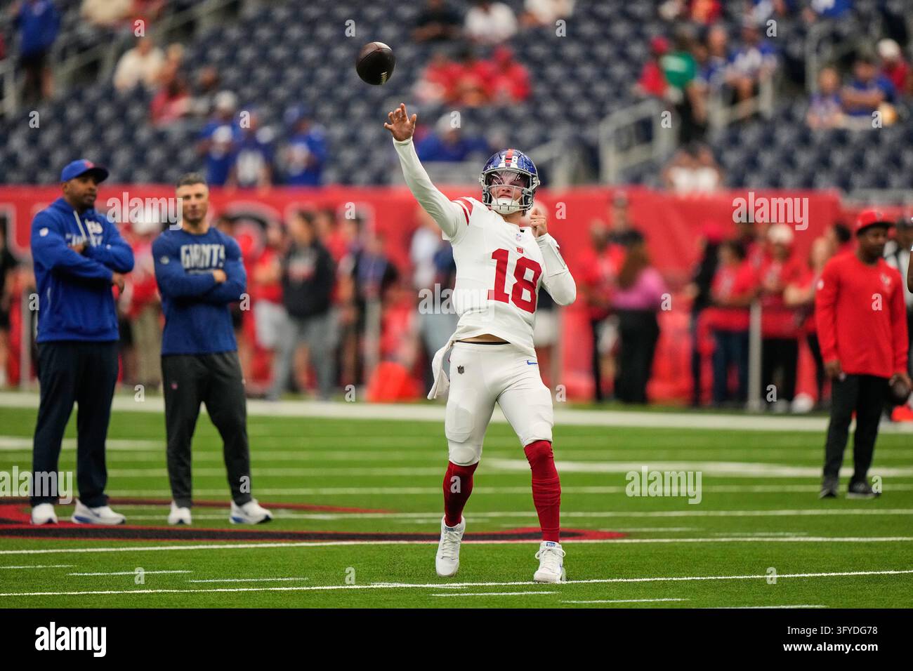 New York Giants quarterback J.J. McCarthy (18) warms up before an NFL ...
