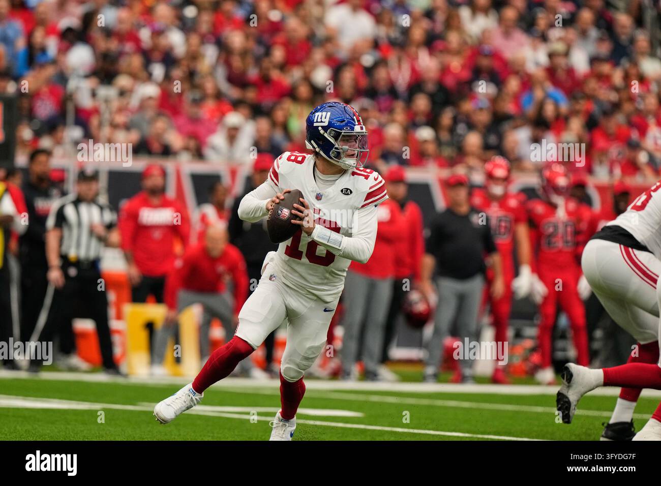 New York Giants quarterback J.J. McCarthy (18) drops back to pass ...