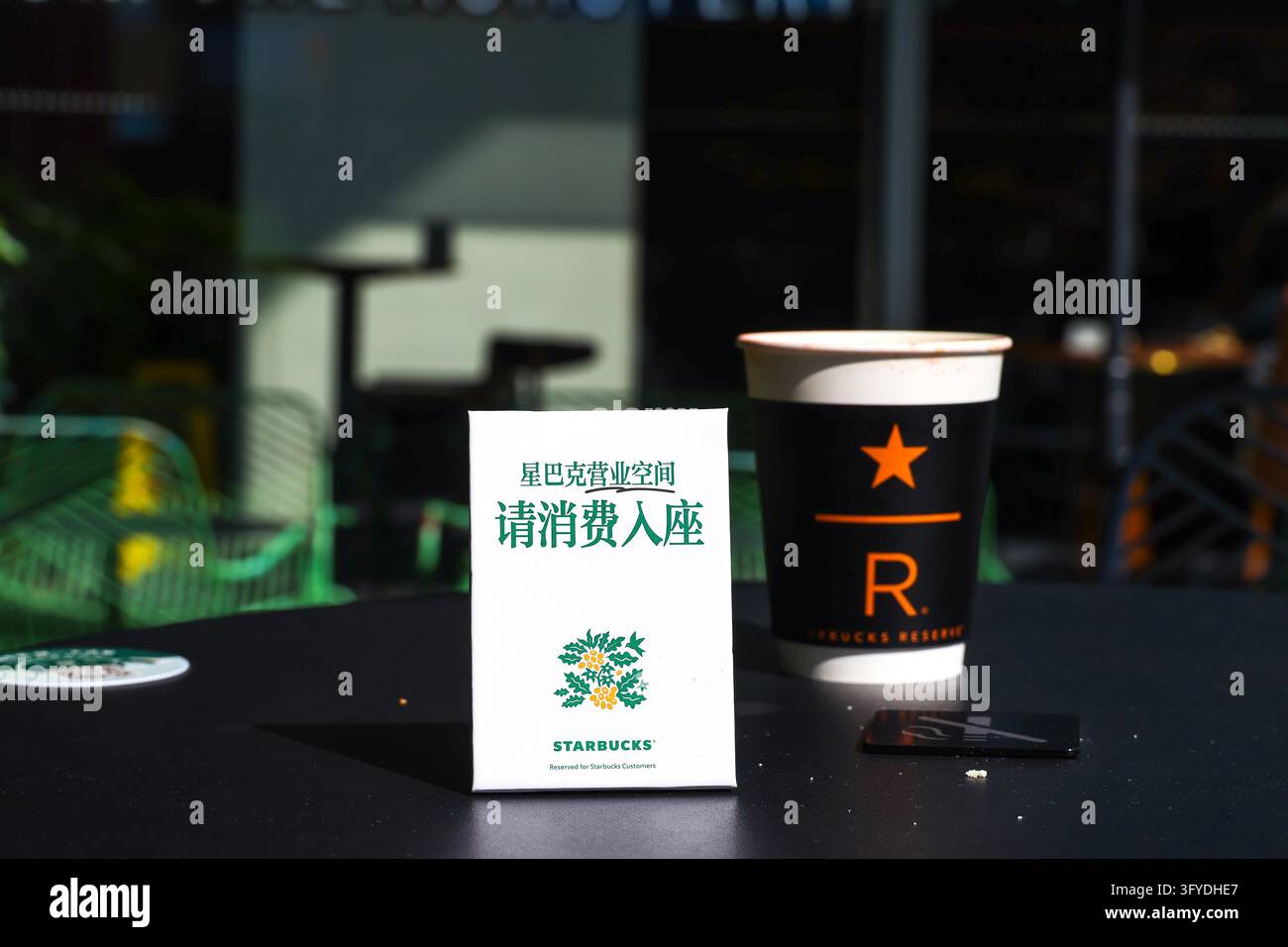Of Users Starbucks stores in Shanghai have set up signs reading 'Please purchase ...