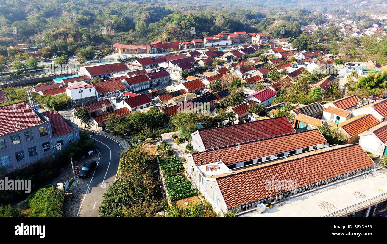 Of Users Aerial view of village homes nestled by mountains and rivers in ...