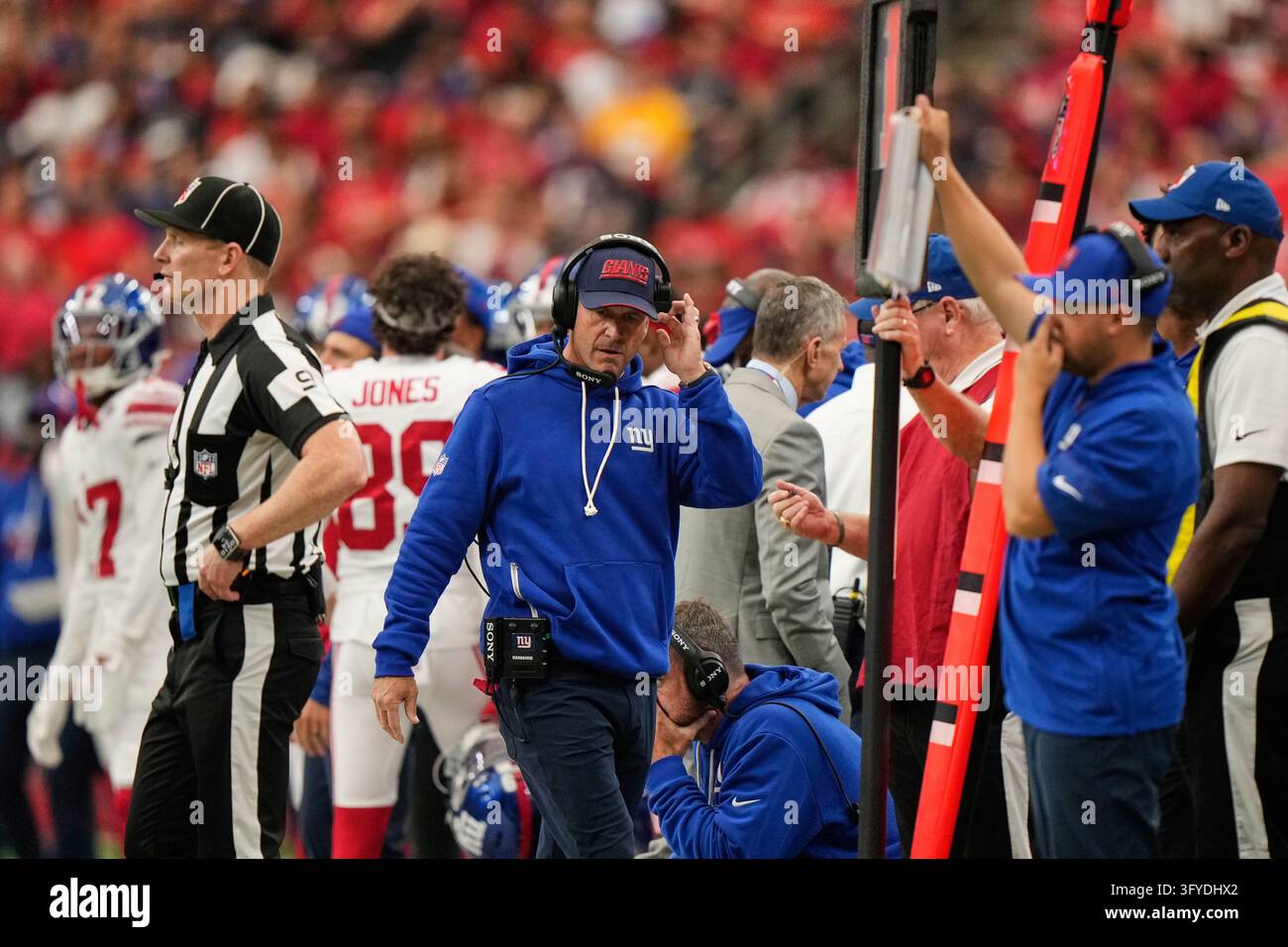 New York Giants head coach John Harbaugh walks on the sideline during ...