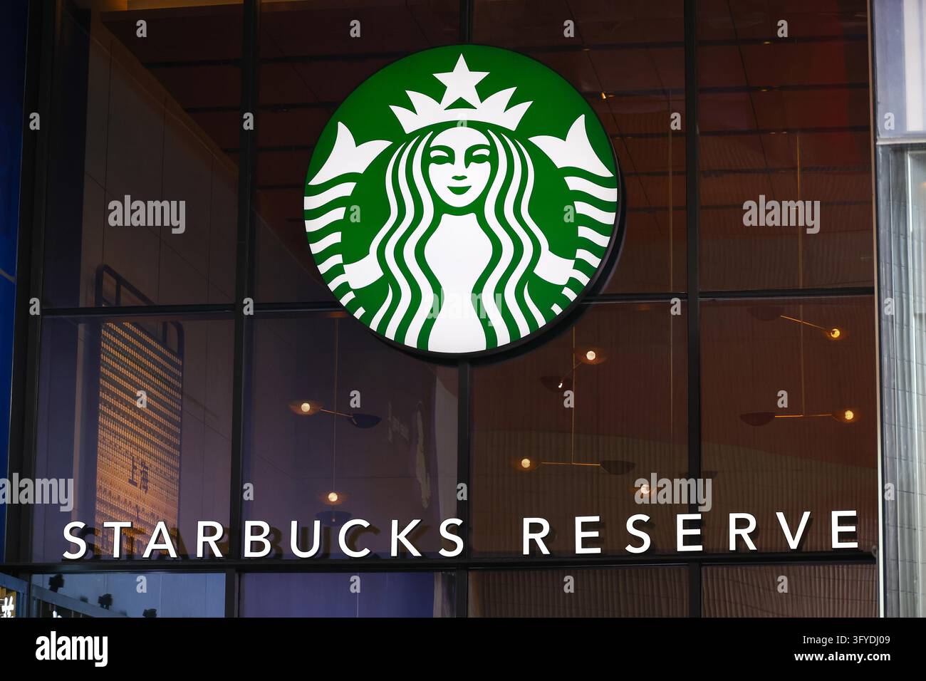 Starbucks stores in Shanghai have set up signs reading 'Please purchase ...