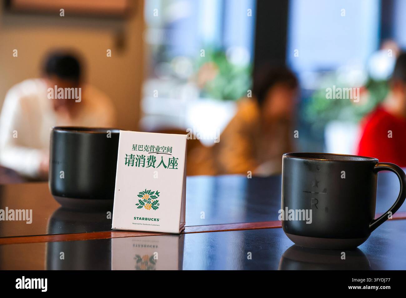 Starbucks stores in Shanghai have set up signs reading 