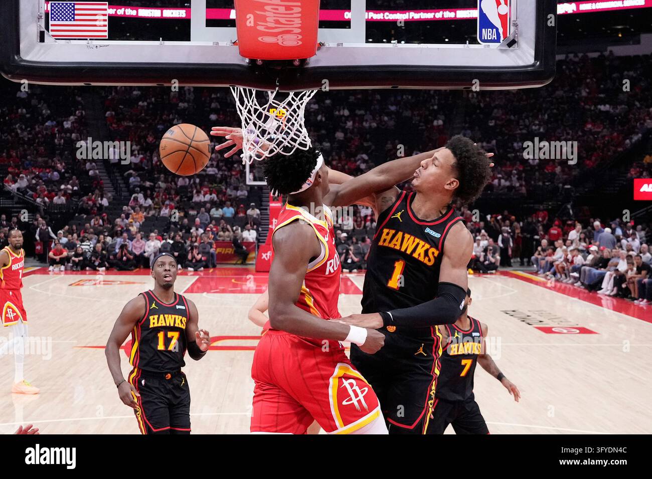 Houston Rockets guard Amen Thompson, center left, and Atlanta Hawks ...
