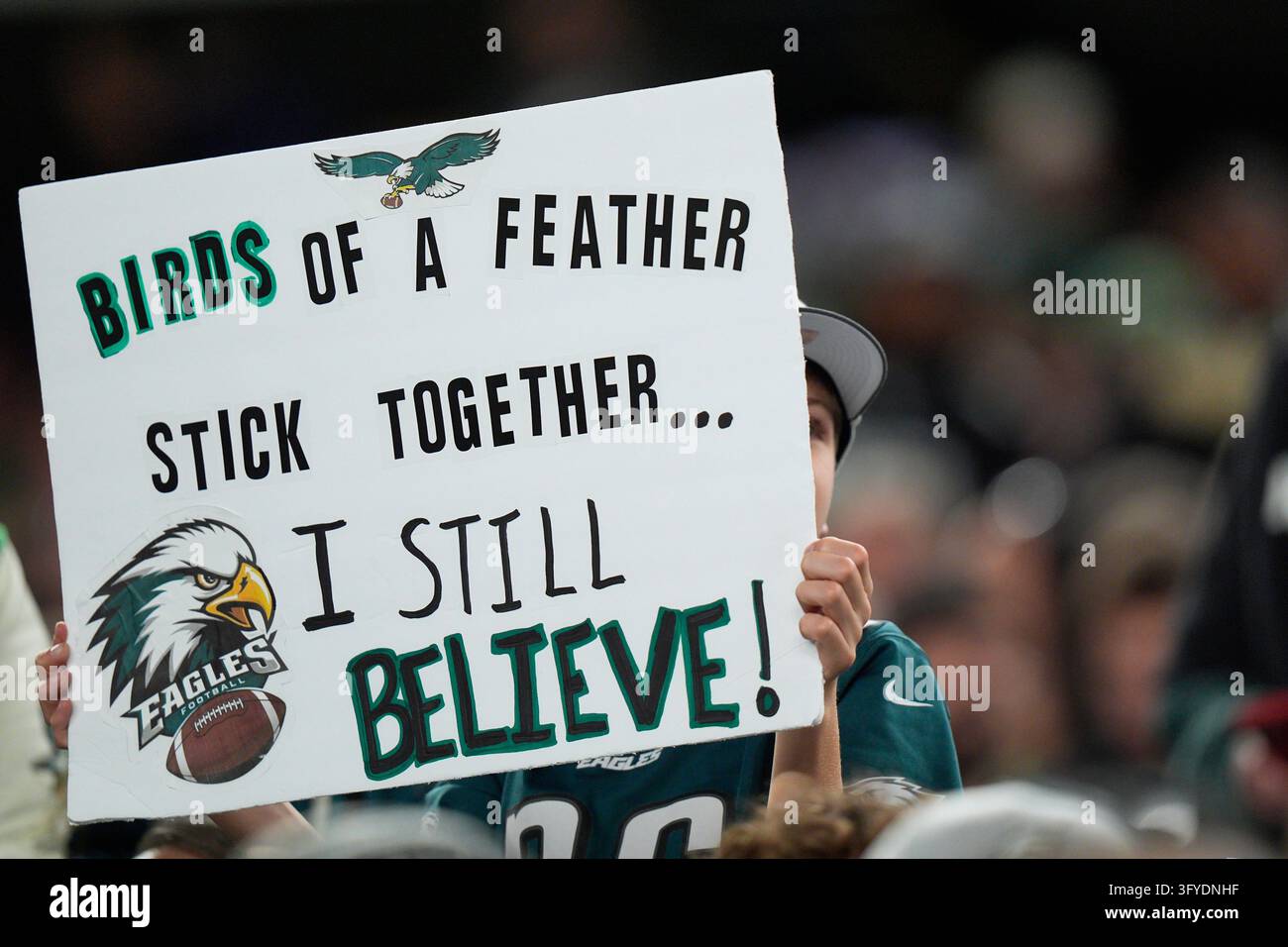 An Philadelphia Eagles fan holds a sign during the first half of an NFL ...