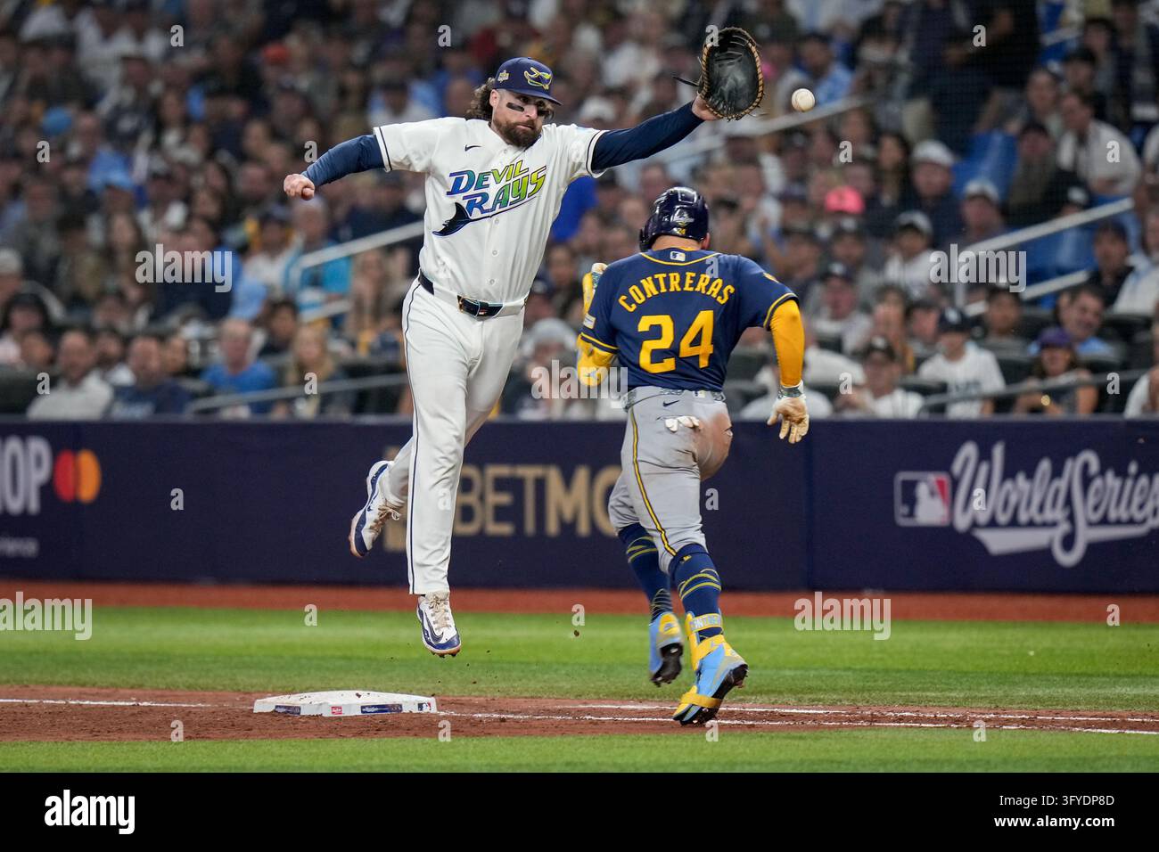 Tampa Bay Rays first baseman Ryan Vilade can't catch a throwing error ...