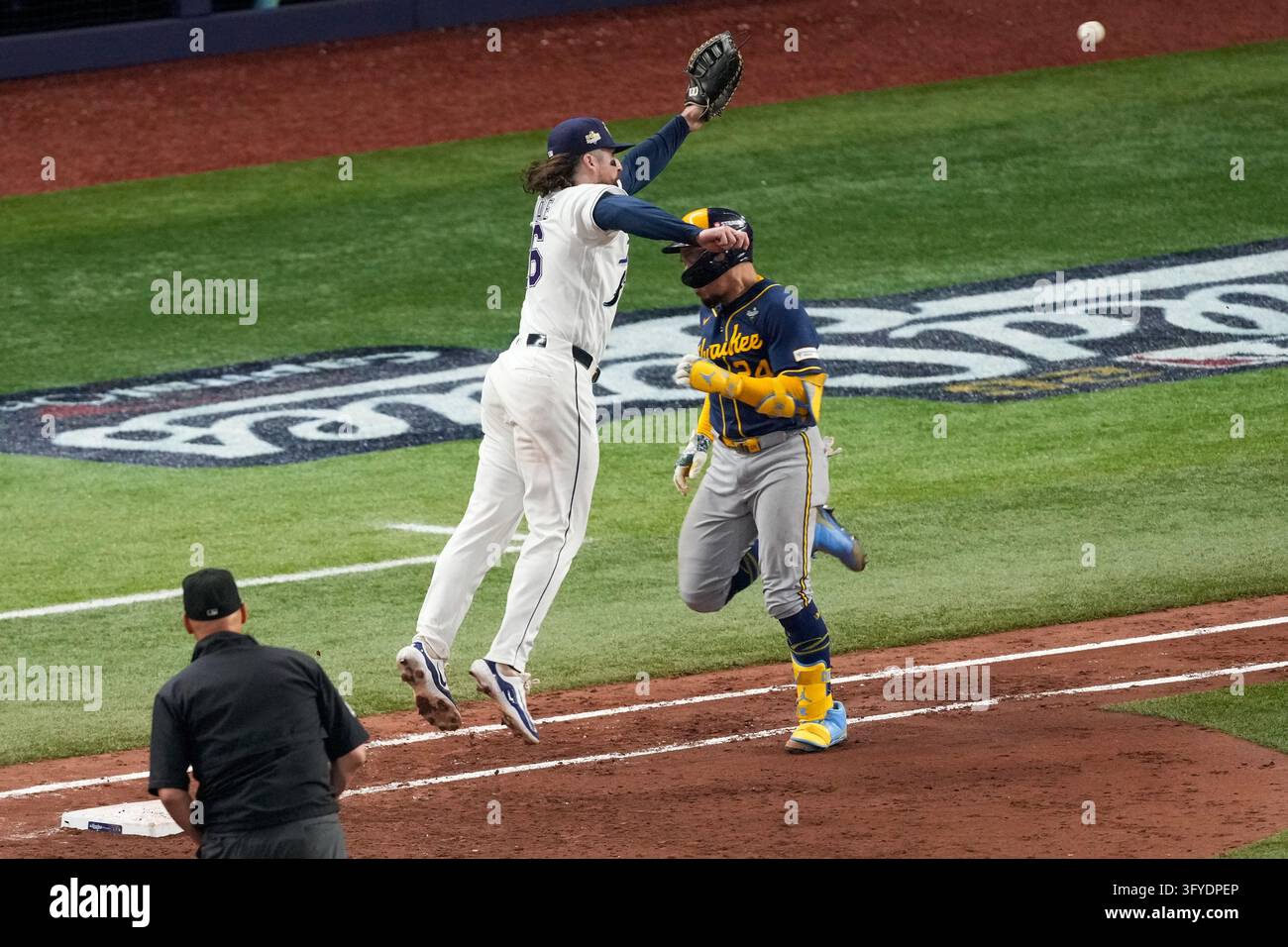 Tampa Bay Rays first baseman Ryan Vilade can't catch a throwing error ...