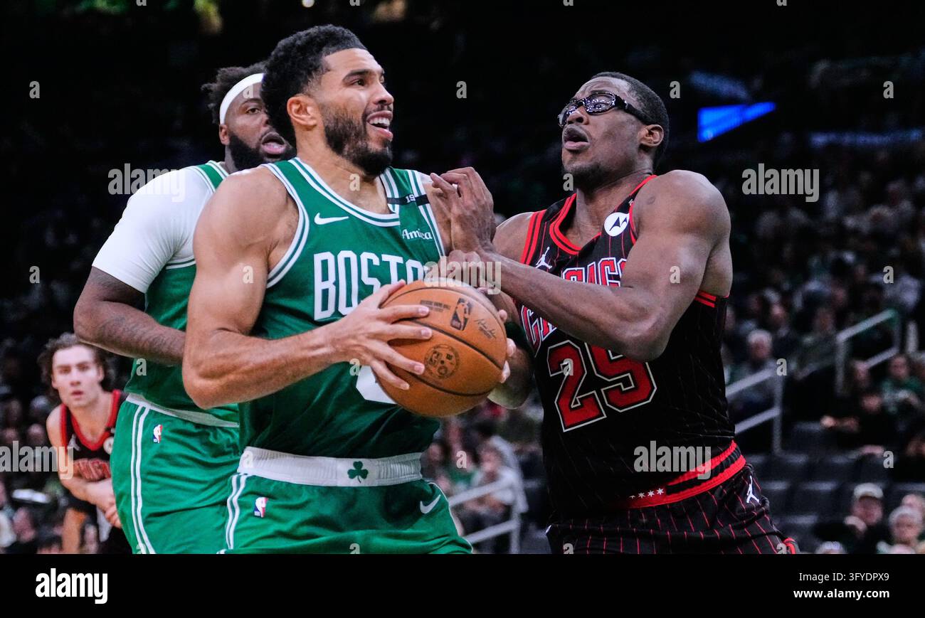 Boston Celtics' Jayson Tatum, left, drives to the basket against ...