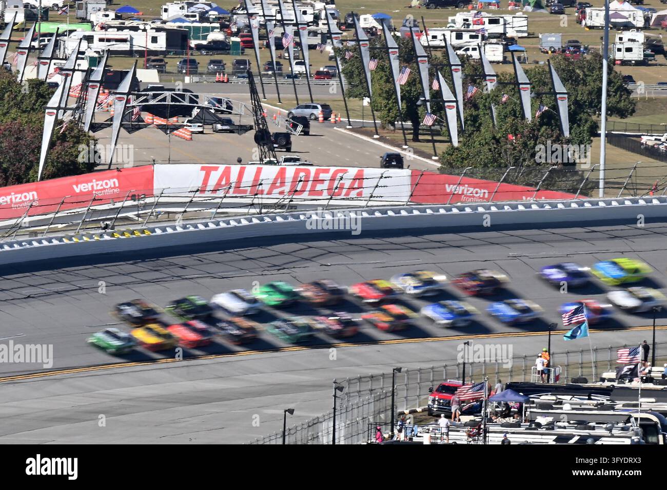 TALLADEGA, AL - OCTOBER 25: The field races through Turn 4 during the ...
