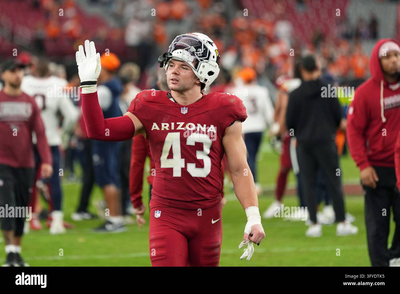 No Loss Vector Arizona Cardinals linebacker Karson Sharar waves to fans as he walks ...
