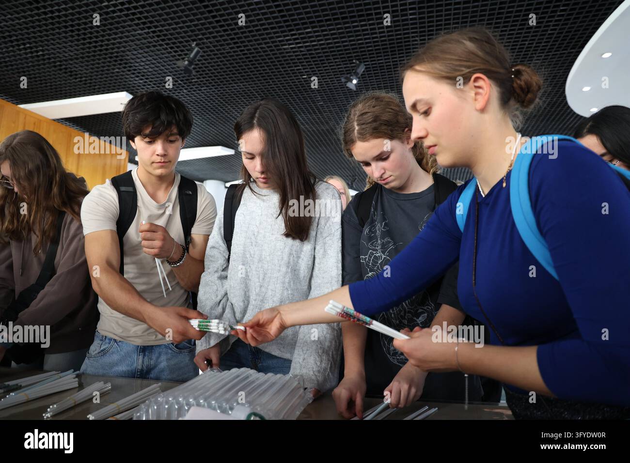 French teenagers select shell porcelain chopsticks at the Marine Shell ...