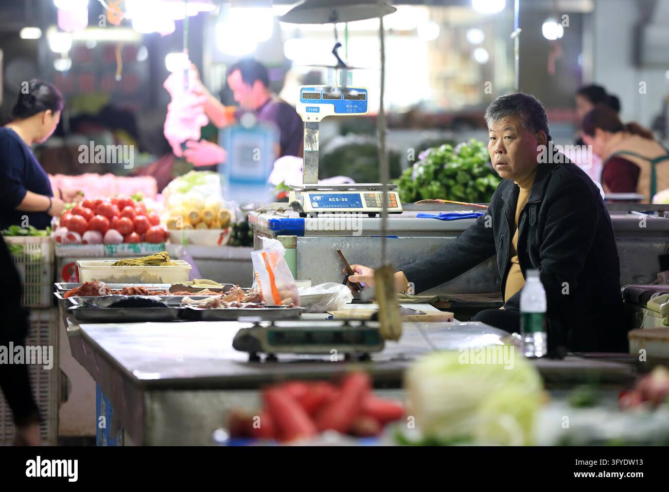 Shoppers purchase goods at a supermarket in Huai'an, east China's ...