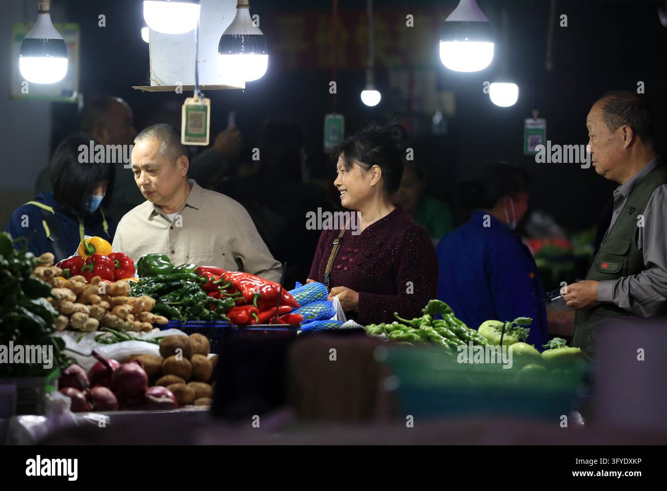 A resident shops at a supermarket in Huai'an, east China's Jiangsu ...