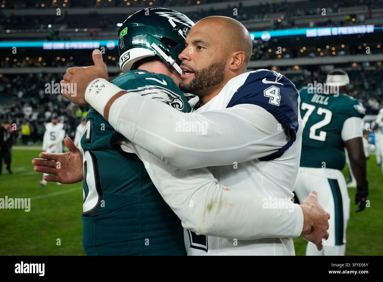 Quarterback Size Dallas Cowboys quarterback Dak Prescott, right, embraces Philadelphia ...