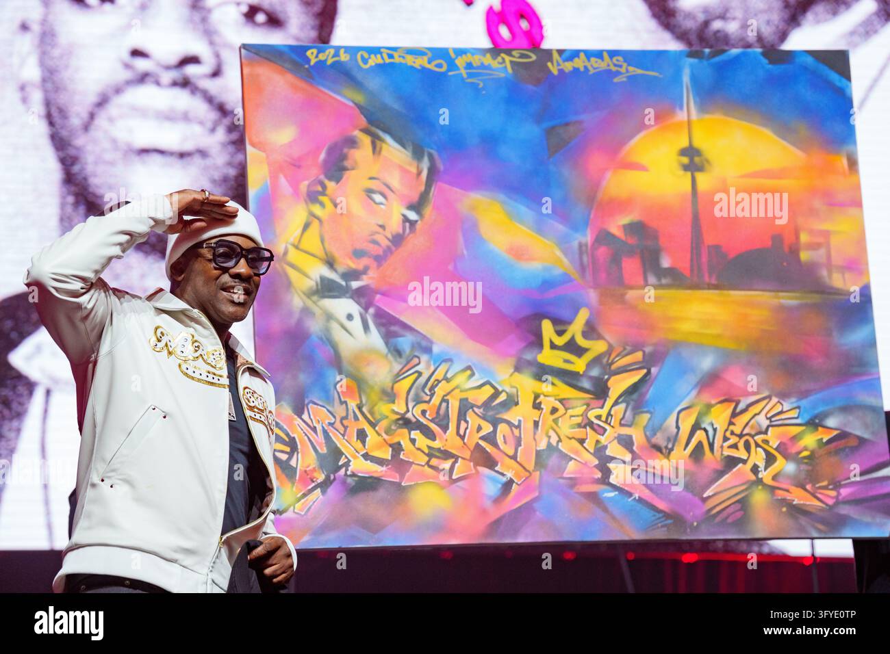 Maestro Fresh Wes is presented with a painting as he accepts the ...