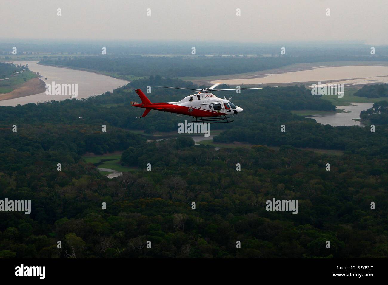 FILE - A helicopter from Brazil's environmental agency flies over an ...