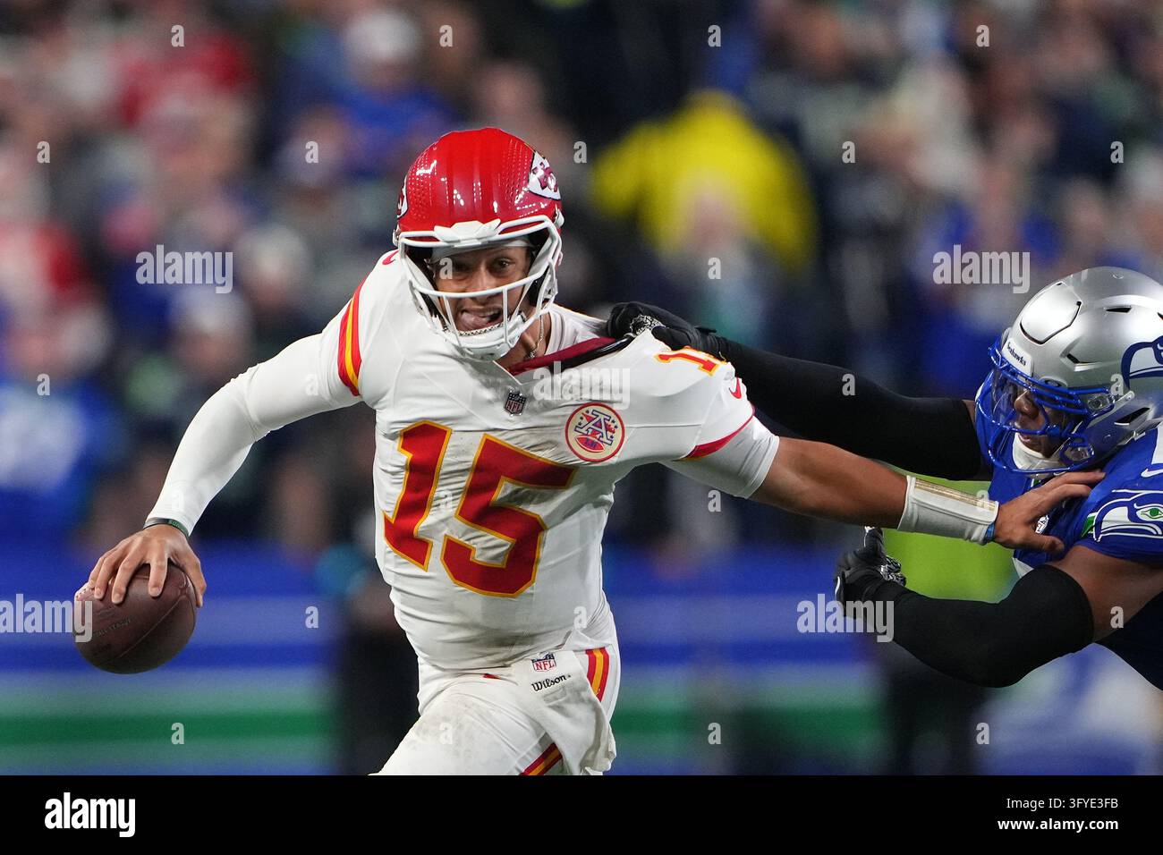 Seattle Seahawks linebacker Uchenna Nwosu (7) horse-collars Kansas City ...