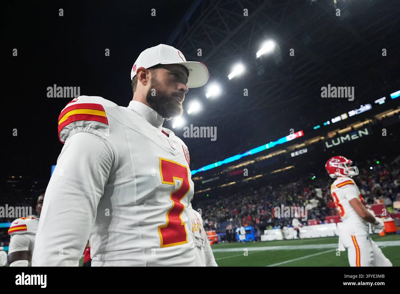 Kansas City Chiefs place-kicker Harrison Butker (7) walks off the field ...