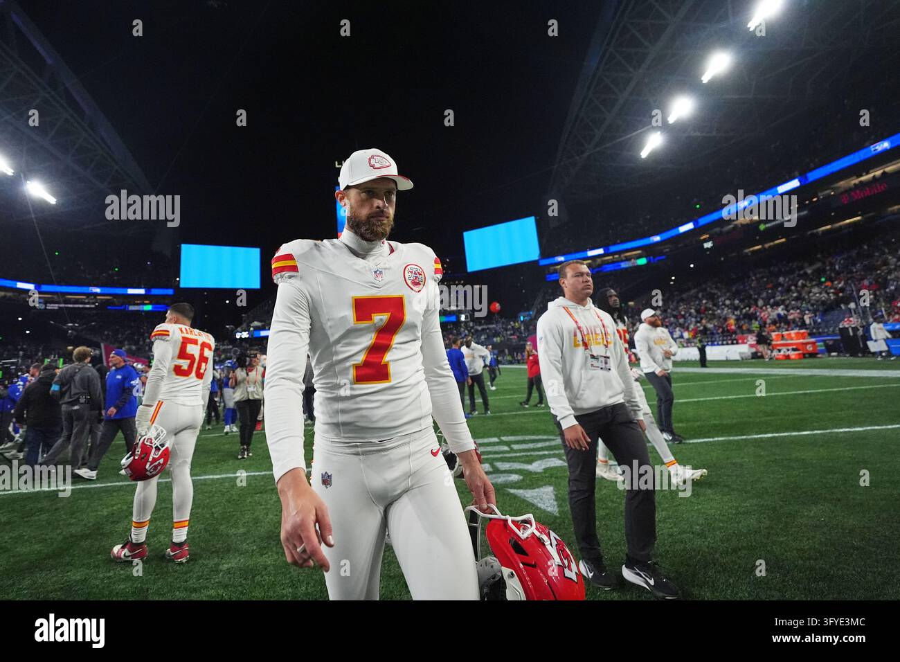 Kansas City Chiefs place-kicker Harrison Butker (7) walks off the field ...
